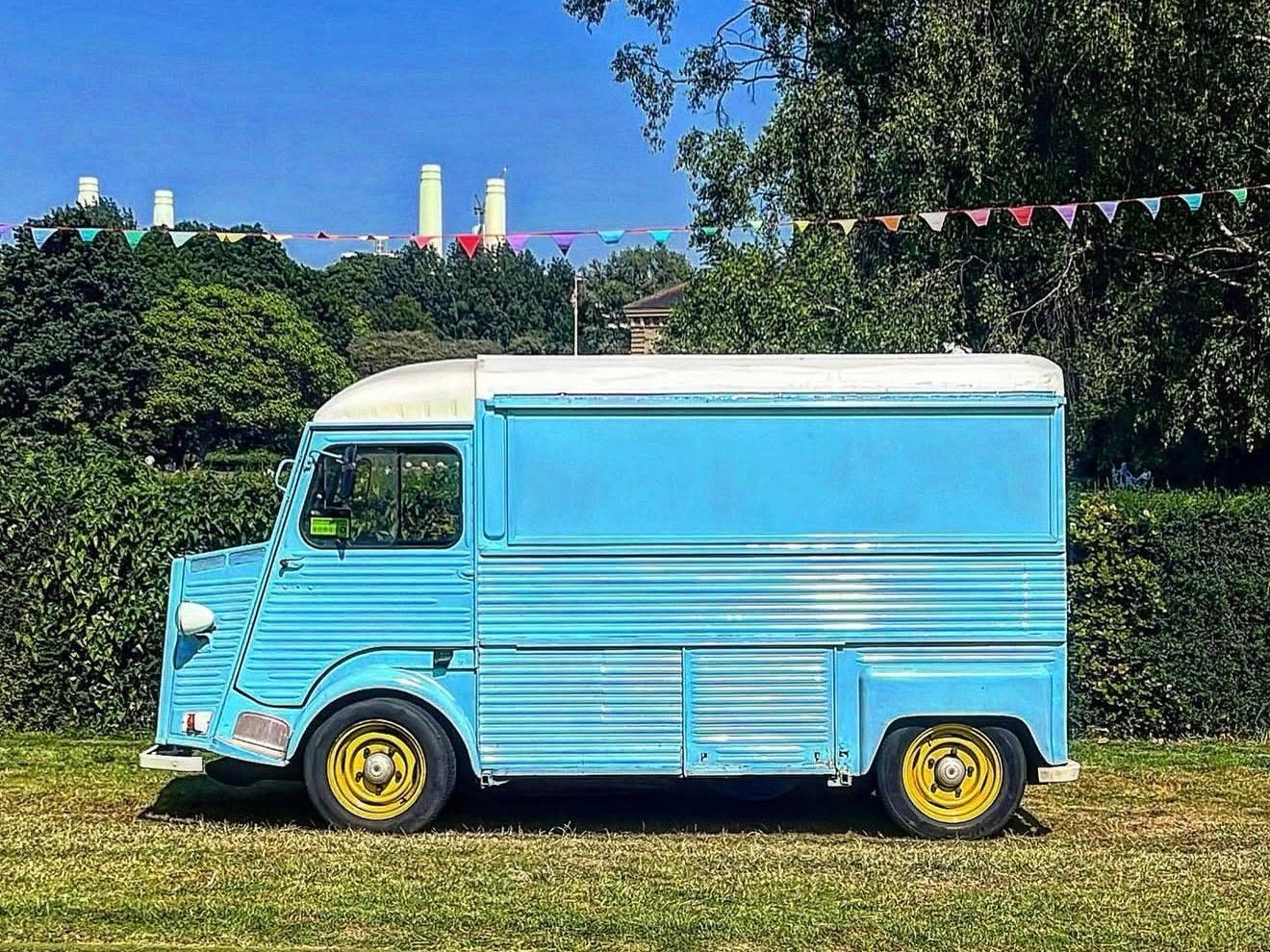 Pizza On The Go van in a sunny London park, summer brochure cover
